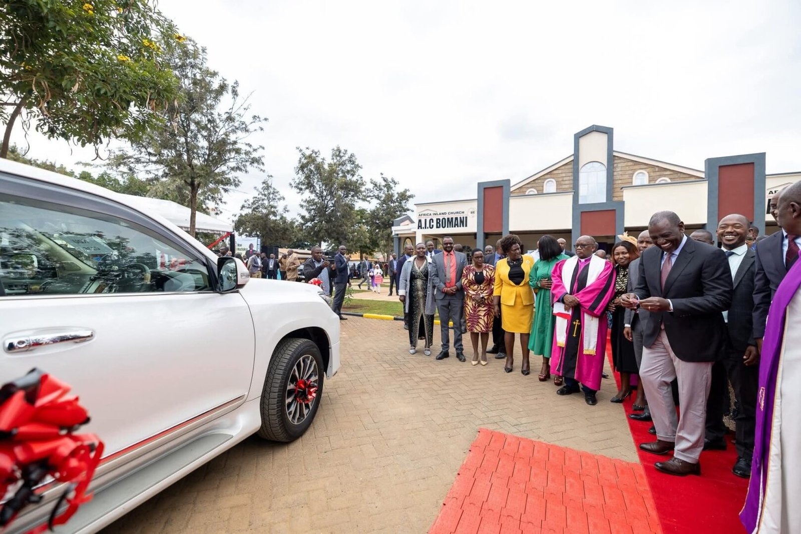 Ruto gifts AIC Bishop Benjamin Kalanzo a Toyota Prado