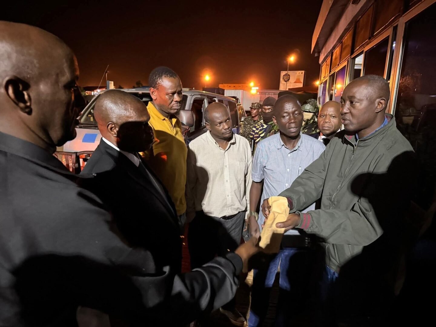 Kenyan activists Bob Njagi and Nicholas Oyoo after their release from Ugandan military detention at Busia border.